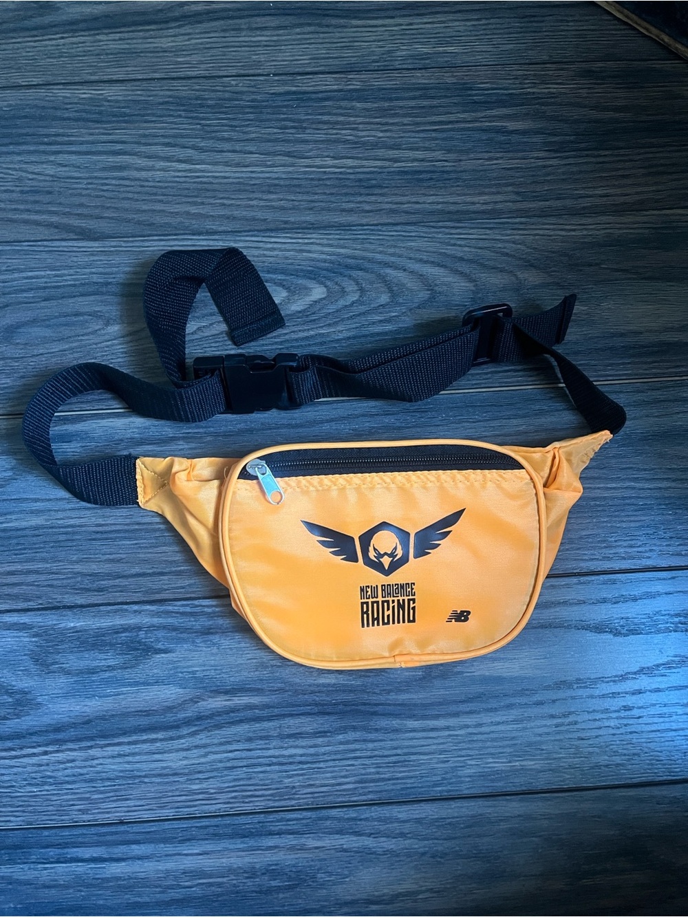 New Balance Orange Racing Belt Bag with Black Strap